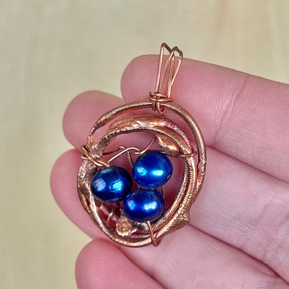 Handmade copper and pearl birds nest pendant
